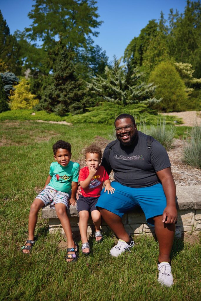 A family smiles at the camera