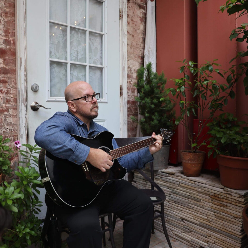 Alan Voss with a guitar